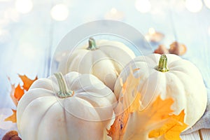 Thanksgiving background. Wooden table, decorated with pumpkins, autumn leaves and candles