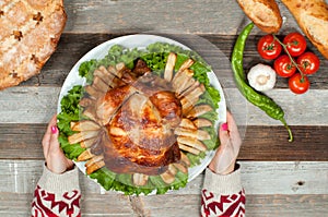 Thanksgiving or Christmas. Homemade roasted whole turkey on wooden table. Thanksgiving Celebration Traditional Dinner Setting
