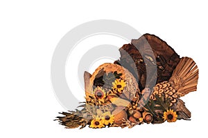 Thanksgiving cornucopia centerpiece with sunflowers, turkey and turkey feathers, oak leaves, celebrating fall autumn harvest holid