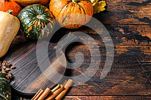 Thanksgiving day or autumn pumpkin holiday background. Dark Wooden background. Top view. Copy space