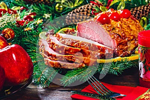 Thanksgiving day. Christmas table dinner time with roasted meats decorated in Christmas style. The concept of a family holiday