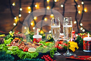 Thanksgiving day. Christmas table dinner time with roasted meats decorated in Christmas style. The concept of a family holiday