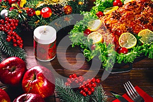 Thanksgiving day. Christmas table dinner time with roasted meats decorated in Christmas style. The concept of a family holiday