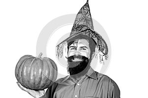 Thanksgiving day cooking. Halloween man with pumpkin - Holidays celebration concept. Young man with witch hat ready to