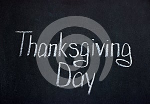 Thanksgiving Day lettering on dark chalkboard. Holiday in the USA