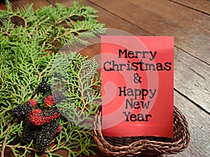 Thanksgiving day. Merry Christmas & happy new year written on card with fresh ornaments background