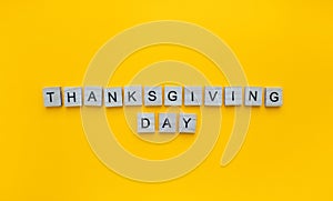 Thanksgiving Day, minimalistic banner with the inscription in wooden letters