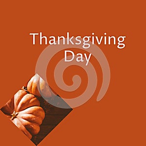 Thanksgiving day text with orange pumpkins on brown background