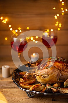 The Thanksgiving dinner with candles, red wine, turkey isolated on wooden background. Holiday concept. Festive mood