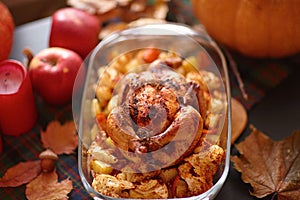 Thanksgiving Dinner. Thanksgiving table served with turkey, decorated with bright autumn leaves.