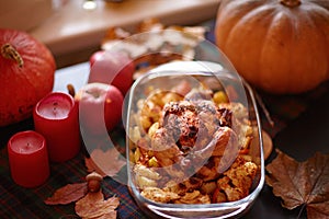 Thanksgiving Dinner. Thanksgiving table served with turkey, decorated with bright autumn leaves.