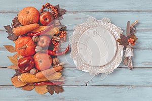 Autumn table setting, menu composition, vintage cutlery, sliced pumpkin.