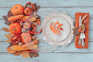 Autumn table setting, menu composition, vintage cutlery, sliced pumpkin.