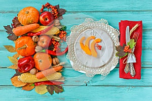 Autumn table setting, menu composition, vintage cutlery, sliced pumpkin.