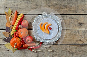 Autumn table setting, menu composition, vintage cutlery, sliced pumpkin.