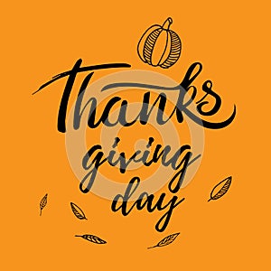 Thanksgiving greeting design with pumpkin, other vegetables, autumn leaves, and calligraphy inscription Thanksgiving Day