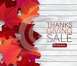 Thanksgiving sale poster.  Background with red and orange maple fall leaves on wooden board. American traditional november holiday