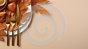 thanksgiving table setting with autumn leaves gold and silverware on a beige background
