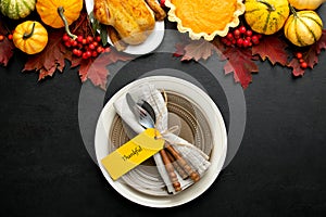 Thanksgiving table setting concept, overhead view on natural fall decor
