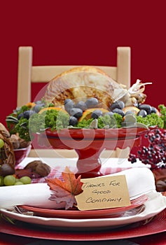 Thanksgiving Table Setting with Roast Turkey on Red White Backgr