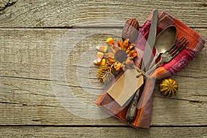 Thanksgiving table setting on rustic wood background