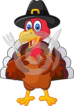 Thanksgiving turkey mascot holding knife and fork and wearing a pilgrim hat