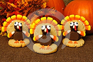Thanksgiving turkey shaped cookies with autumn leaves and pumpkins