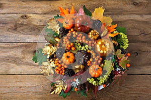 Thanksgiving wreath on the old wooden table