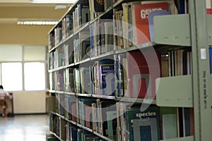 Old bookshelf with books arranged neatly in a wide variety of large libraries..