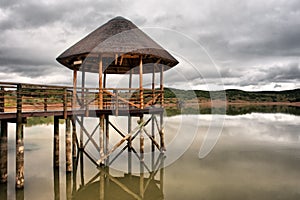 Thatch pavilion on lake in Karoo
