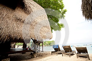 Thatch roof bungalow at tropical resort