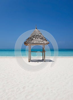 Thatched beach canopy or parasol on the beach, ocean