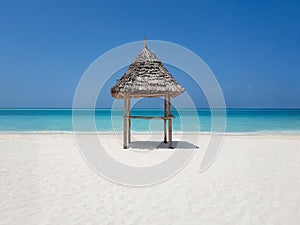 Thatched beach canopy or parasol on the beach, ocean