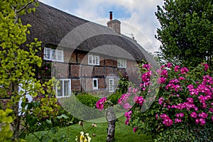 Thatched cottages in a hampshire village in the UK.