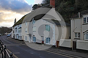 Thatched cottages on a street, close to the sea at Minehead, Somerset photo