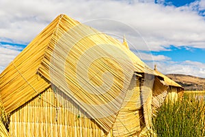 Thatched home on Floating Islands on Lake Titicaca Puno, Peru, South America. Dense root that plants Khili interweave