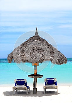 Thatched hut on a stretch of beach in Aruba