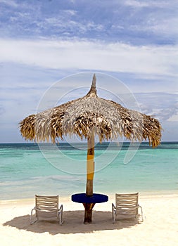 Thatched hut on a stretch of beach in Aruba