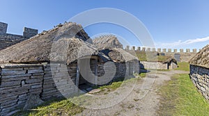 Thatched huts in Eketorps borg, a viking village in Ã–land, Sweden