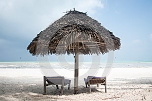 Thatched umbrella on the beach at Paje, Zanzibar photo