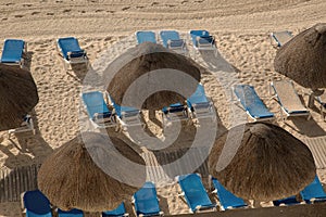 Thatched Umbrellas on the Beach at Cancun, Mexico