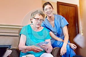 Thats a great hand. seniors playing cards in their retirement home.