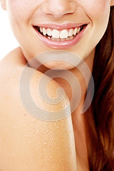 Thats one winning smile. Studio shot of a beautiful young woman with perfect skin isolated on white.