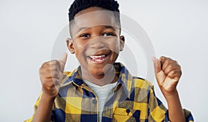 Thats a yes from me. Portrait of an adorable little boy posing against a white background.