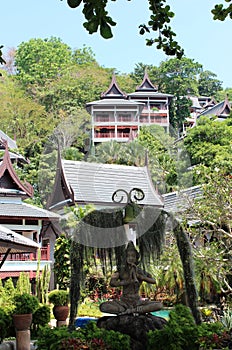 Thavorn Beach Village, Phuket, Thailand. Figure in yoga stance