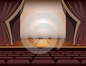 A theater stage with a curtain and seats.
