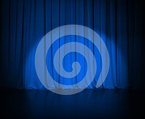 Theatre dark blue curtain or drapes with light