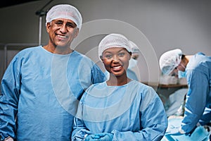 Theatre, portrait and happy doctors in hospital teamwork, leadership and medical surgery with internship opportunity