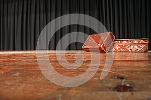Theatre Stage. On the stage there are two suitcases.
