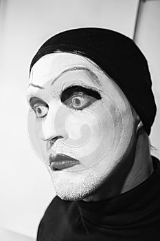 Theatrical actor with dark mime makeup